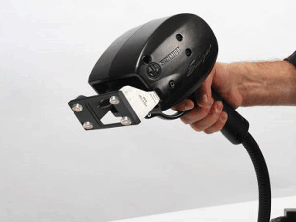 A handheld dot peen pin marker with a magnetic faceplate